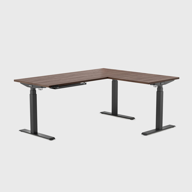 This spacious L-shaped standing desk provides a generous surface for dual monitors, tablets, or paperwork — all while supporting extended use throughout your day, essentially functioning as a corner standing computer desk with room for all your gear.